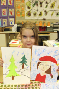 Heidi Puhakka piirsi tontun ja joulukuusen.